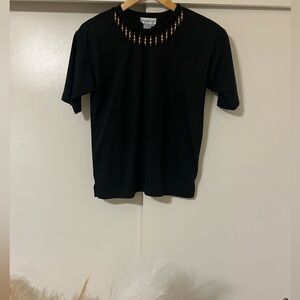Elegant Black Tee with Gold Accents